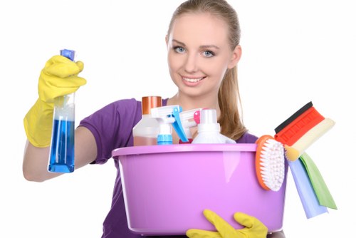 Professional cleaner maintaining shared hallway and staircase