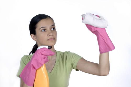 Removing stains from a sofa during cleaning service