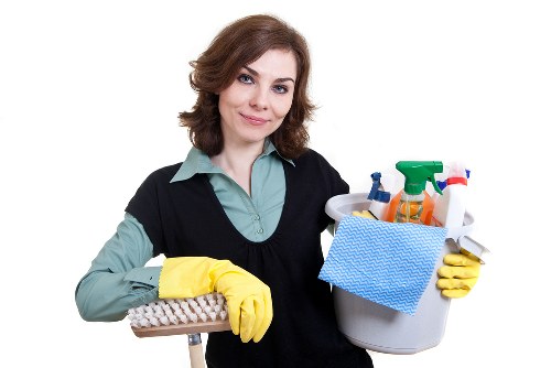 Kitchen surfaces being cleaned during domestic cleaning